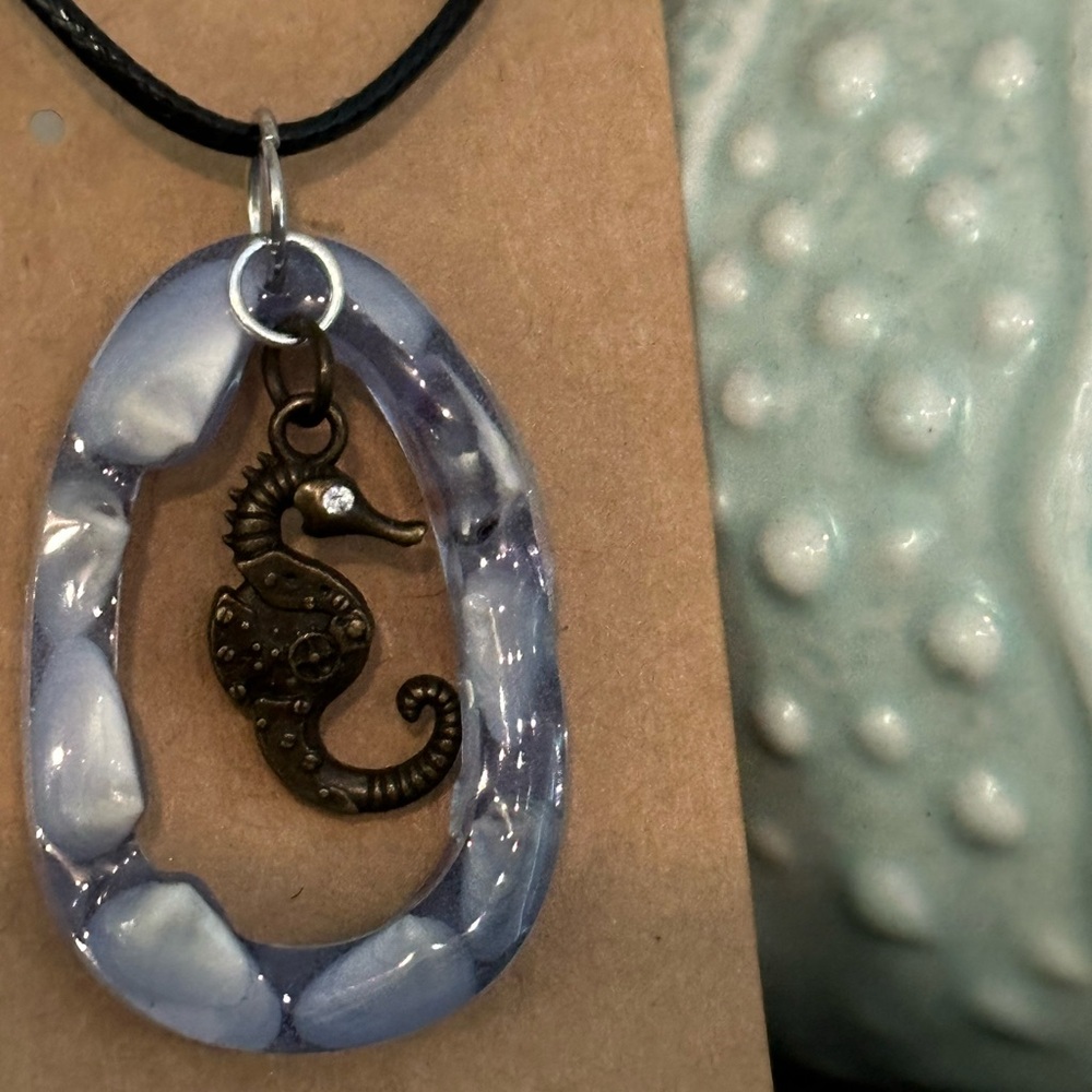 New handmade pendant necklace made from resin , shells and rustic charm